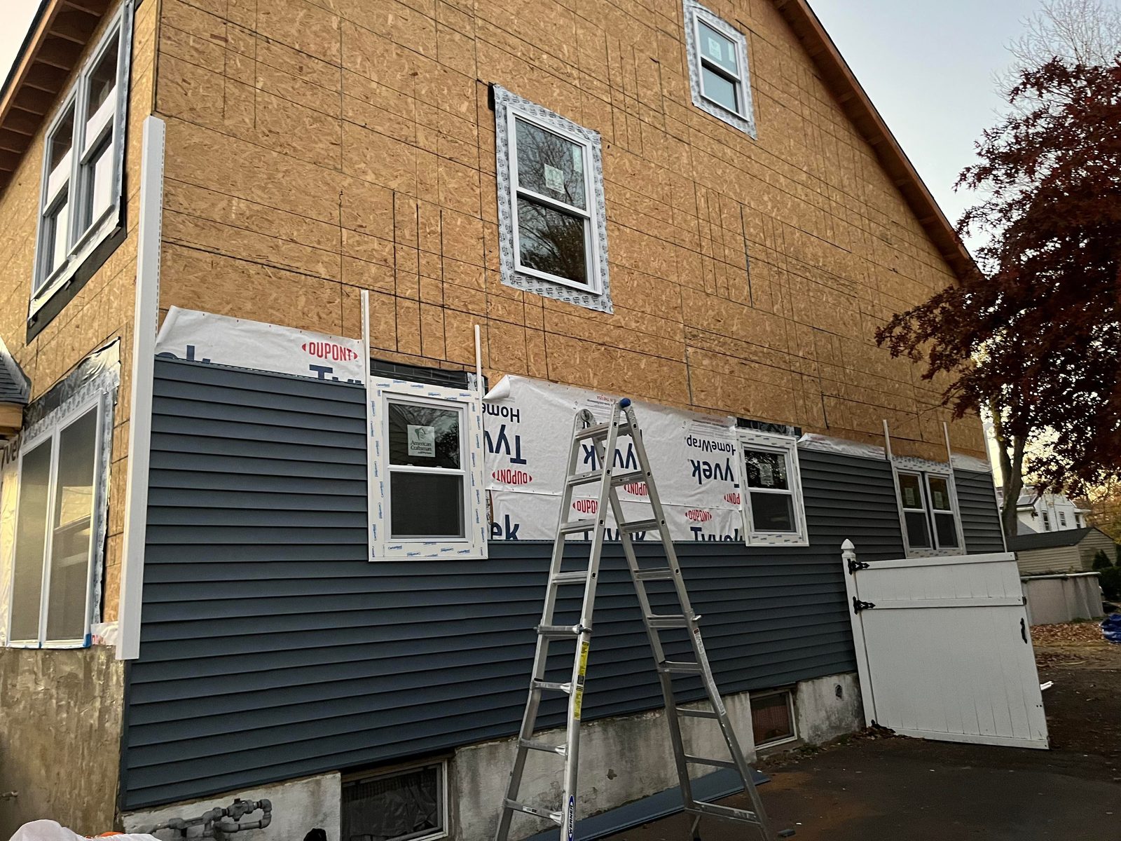 New vinyl siding and trim installed on a New Jersey home